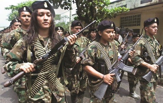 Guerrillas of the Marxist Revolutionary Armed Forces of Colombia (FARC) march in a military parade on February 7,  2001 in San Vicente.