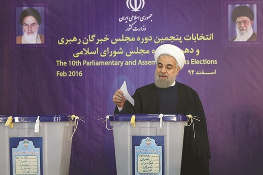 Iranian President Hassan Rouhani casts his vote during elections for the parliament and Assembly of Experts in Tehran yesterday.