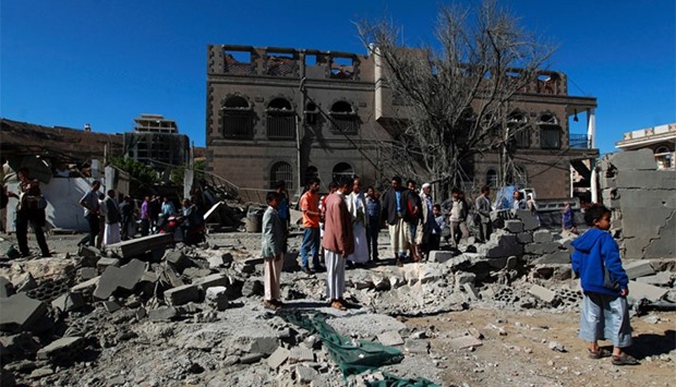 Yemenis inspect the damage following an air-strike by the Saudi-led coalition in the capital Sanaa. AFP