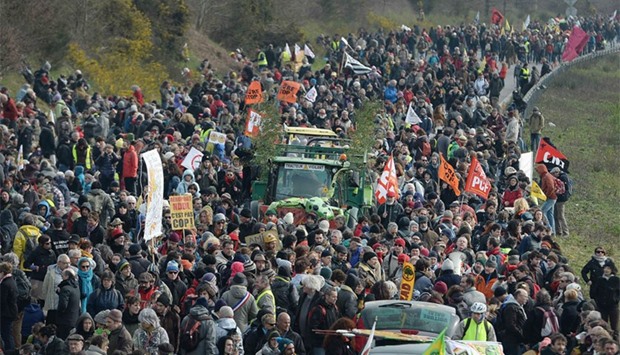 French protesters march on a highway in Le Temple-de-Bretagne during a demonstration against a controversial airport project near Nantes. AFP