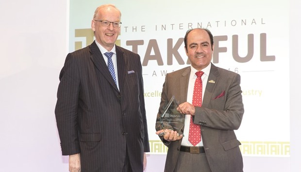 Al-Abdulghani (right) with the prestigious u2018Takaful CEO of the yearu2019 award that was handed over to him at a ceremony held during the 10th International Takaful Summit 2016 at Jumeirah Carlton Tower in London recently.
