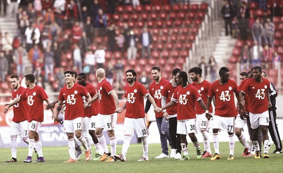 Olympiakos players celebrate after clinching a record-extending 43rd Greek Super League title with a 3-0 victory over Veria.