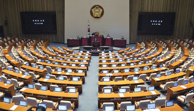 Choi Kyu-sung (centre), a member of the main opposition Minjoo Party of Korea, speaks at the National Assembly in Seoul. South Korean opposition lawmakers seeking to block a government-backed u2018anti-terrorismu2019 bill pushed their record-breaking filibuster into a sixth straight day of speeches in the parliamentary chamber yesterday.