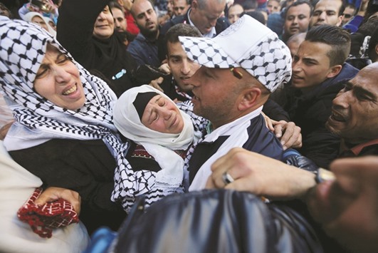 Freed Palestinian prisoner Ashraf Hamash is hugged by his mother upon his release from an Israeli jail in Khan Younis in the southern Gaza Strip. Hamash served 12 years in an Israeli jail after he was convicted of trying to carry out an attack against Israeli soldiers at a checkpoint.