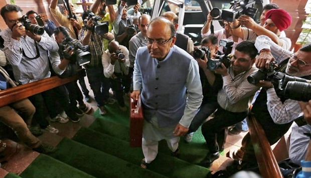 Finance Minister Arun Jaitley arrives at the parliament to present the federal budget for the 2016/17 fiscal year, in New Delhi on Monday.