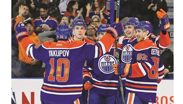 The Edmonton Oilers celebrate a third period goal by defensemen Brandon Davidson against the New York Islanders at Rexall Place. PICTURE: USA TODAY Sports