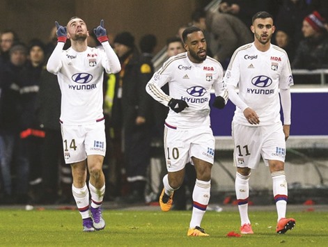 Olympique Lyonu2019s Sergi Darder (left) celebrates after scoring against Paris St-Germain in their Ligue 1 clash on Sunday. (Reuters)