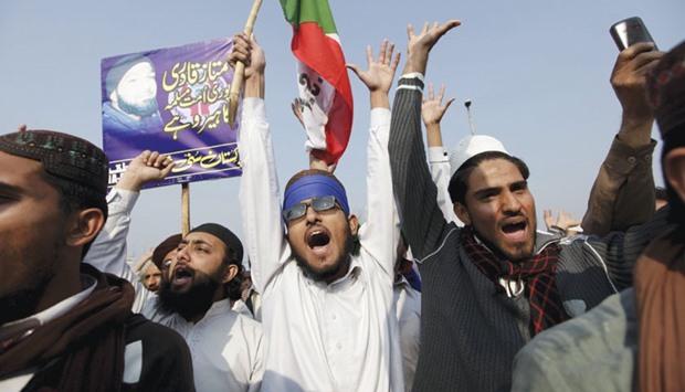 Supporters of a religious political party shout slogans to protest against the execution of Mumtaz Qadri, in Rawalpindi, yesterday.