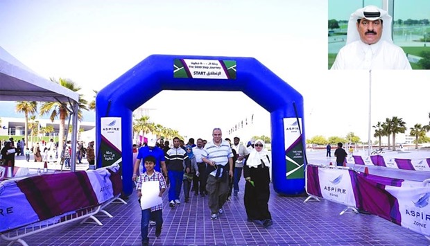 Families participating in 5000 steps. Inset, Ali al-Fhaida.
