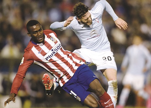 This file photo shows Atletico Madrid forward Jackson Martnez (L) fighting for the ball with Celta Vigou2019s defender Sergi Gomez.