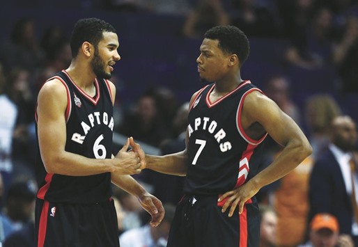 Toronto Raptors guard Kyle Lowry (7) celebrates with guard Cory Joseph (6) in the closing seconds of the game against the Phoenix Suns at Talking Stick Resort Arena. The Raptors defeated the Suns 104-97.
