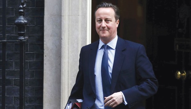 Prime Minister David Cameron leaves Downing Street in London yesterday.