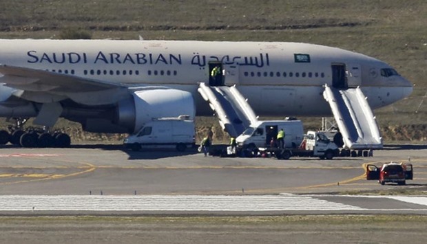Saudi Arabian Airlines flight SVA 226 is isolated on the tarmac after its passengers and crew were evacuated following a bomb threat, at the Barajas airport in Madrid on Thursday.