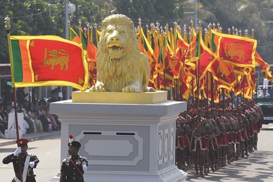 Military personnel march during the Sri Lankau2019s 68th Independence Day celebrations in Colombo yesterday.