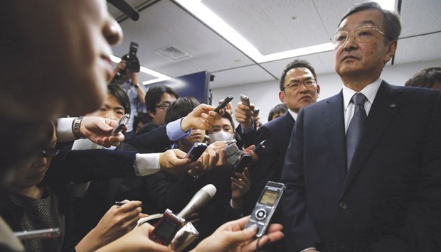 Sharp chief executive Kozo Takahashi speaks to reporters after a news conference in Tokyo yesterday. The struggling Japanese electronics maker has decided to give Taiwanu2019s Foxconn preferred negotiating rights in takeover talks, choosing its more generous offer over a rescue plan from a Japanese state-backed fund, sources with knowledge of the decision said.
