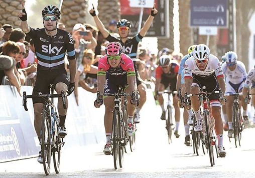 Italian sprinter Elia Viviani (L) of Team Sky celebrates after winning the second  stage of the Dubai Tour yesterday.