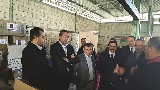 Qatar and Albania officials at an aid distributing centre.
