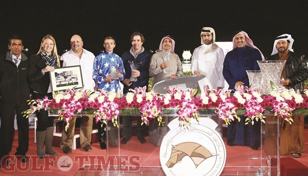 QREC chairman Sheikh Mohamed bin Faleh al-Thani (second from right), Kia representative Abdullah Mohamed Abdullah al-Attiyah and QREC head of Media Saad Mubarak al-Hajri (right) with the winners of the Purebred Arabian Sword Trial at the QREC yesterday. PICTURES: Juhaim