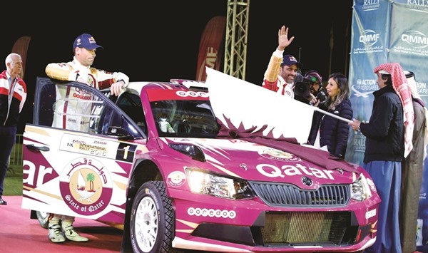 Qataru2019s Nasser Saleh al-Attiyah and his French co-driver Mathieu Baumel at the start of the Qatar International Rally yesterday.