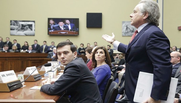 Shkreli (left) listens while his lawyer Brafman addresses the House Oversight and Government Reform hearing on u2018Developments in the Prescription Drug Market Oversightu2019 on Capitol Hill in Washington.