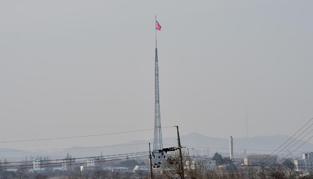 A North Korean flag flutters in the propaganda village of Gijeongdong as seen from South Korea's Taesungdong freedom village in the Demilitarized zone dividing the two Koreas in Paju on Thursday.