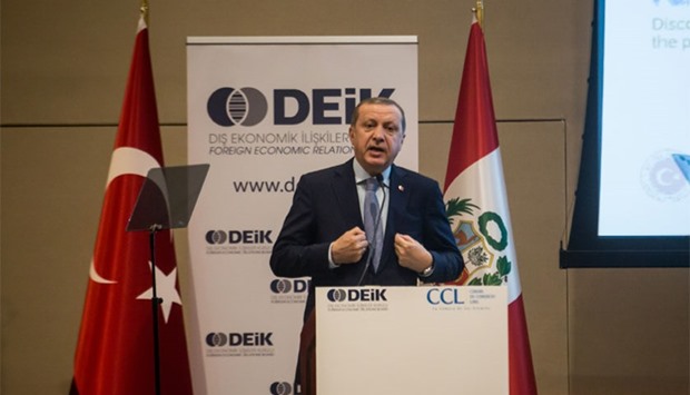 Turkish President Recep Tayyip Erdogan delivers a speech at the Peru-Turkey Business Forum in Lima organized by the Foreign Economic Relations Board of Turkey (DEIK) and Lima Chamber of Commerce during his visit to Peru, on February 3, 2016. AFP