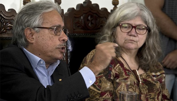Paulo Gadelha (R), director of the Oswaldo Cruz Foundation (FIOCRUZ) research institute and Myrna Bonaldo (RL), molecular biology laboratory chief, announce in a press conference in Rio de Janeiro, Brazil the find of evidence of the presence of zika virus in urine and saliva. AFP