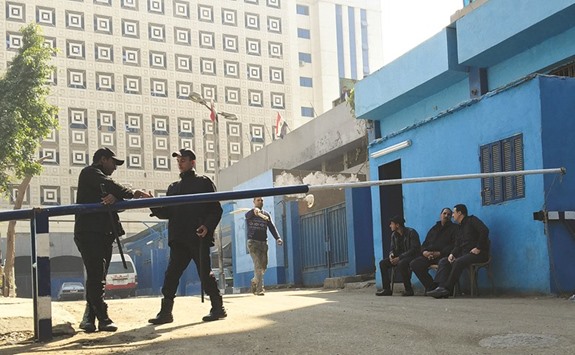 Policemen guard in front of a morgue where the body of an Italian Giulio Regeni is kept in Cairo.