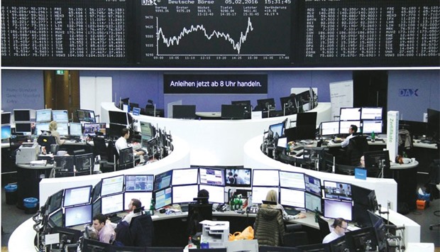 Traders work at the stock exchange in Frankfurt. The DAX closed 1.14% down at 9,286.23 points yesterday.