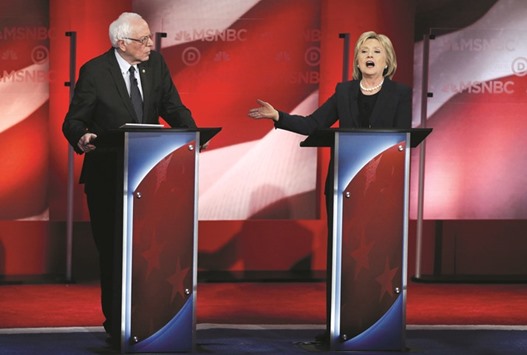 Sanders and Clinton argue over issues during the Democratic presidential candidatesu2019 debate, sponsored by MSNBC, at the University of New Hampshire in Durham, New Hampshire.