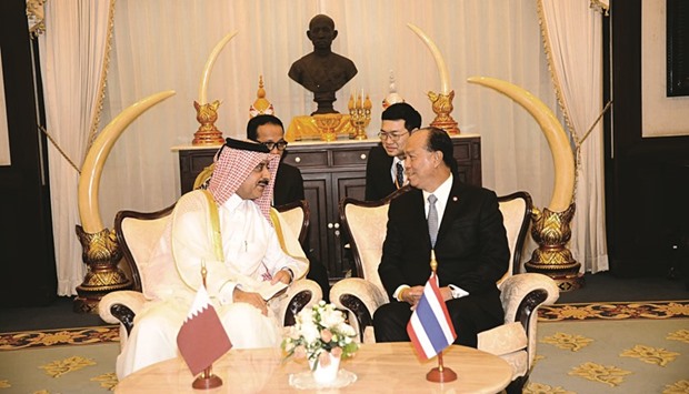The Thai minister and the Qatar envoy during a meeting.
