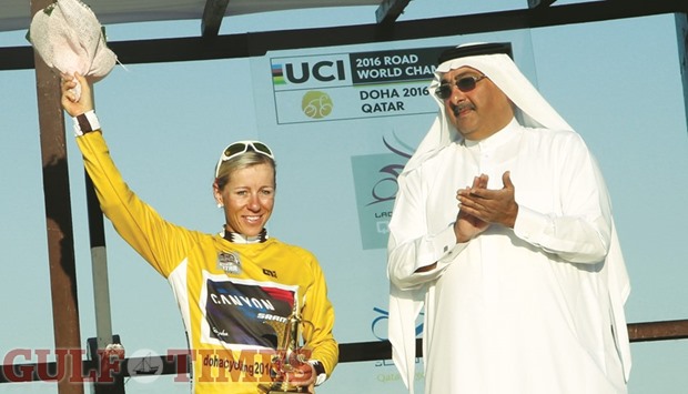 German rider Trixi Worrack of SRAM-Canyon Racing celebrates after winning the Ladies Tour of Qatar along with Qatar Cycling Federation president Sheikh Khalid bin Ali al-Thani at Doha Corniche yesterday. PICTURE: Jayaram