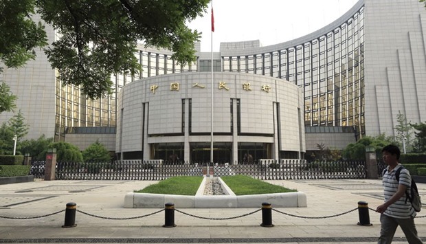 The Peopleu2019s Bank of China in Beijing. The central bank yesterday said it will seek to explore mechanisms to enhance management of interest rates, while increasing the flexibility in both directions of the yuan exchange rate.