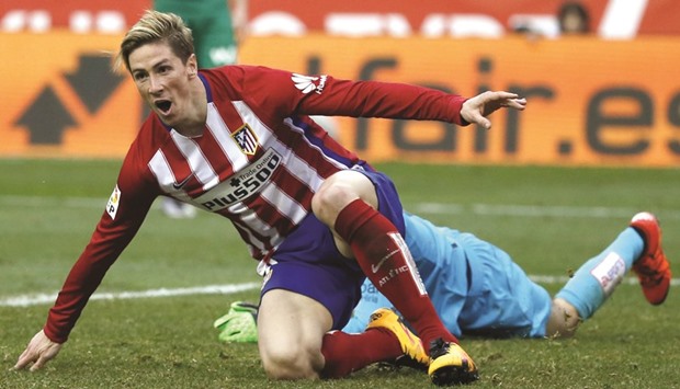 Fernando Torres celebrates after scoring 100th goal for Atletico Madrid yesterday. (Reuters)