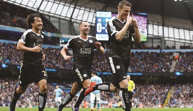 Leicester Cityu2019s German defender Robert Huth (R) celebrates after scoring his second goal during the English Premier League match against Manchester City in Manchester. (AFP)