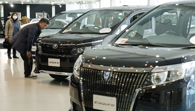 A man looks at Toyota cars at the companyu2019s showroom in Tokyo. Japan, North America and Europe continue to take the lionu2019s share of the Japanese firmu2019s global sales but in China, the worldu2019s biggest car market, itu2019s been losing ground to Honda faster than itu2019s been gaining on market leader Nissan, according to data obtained by Bloomberg.
