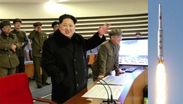 North Korean leader Kim Jong-Un (C) attending the rocket launch