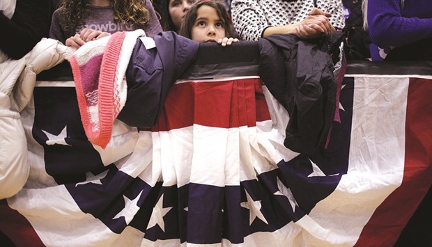 A girl in the audience listens as US Democratic presidential candidate Hillary Clinton speaks at a campaign rally in Portsmouth, New Hampshire.