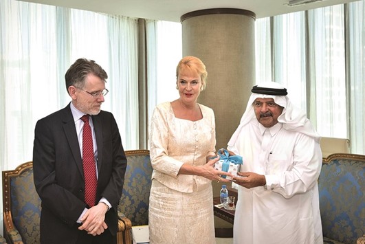 Sheikh Faisal presents the QBA Crystal Shield to Swedish ambassador Eva Polano.