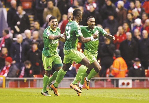 Jermain Defoe (right) celebrates with teammates after scoring the equaliser for Sunderland in their Premier League clash against Liverpool on Saturday.(Action Images via Reuters)