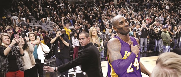 Kobe Bryant of the Los Angeles Lakers acknowledges San Antonio Spurs fans at the end of the game at AT&T Center.