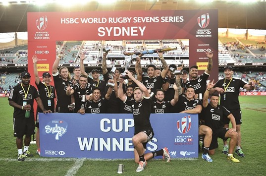 New Zealand team pose with the trophy after beating Australia.