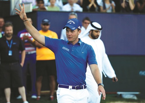 Danny Willett of England celebrates after winning the Dubai Desert Classic golf championship in Dubai yesterday.