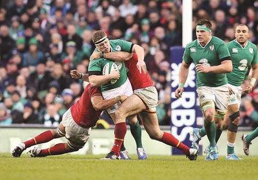 Irelandu2019s  Sean Cronin (C) is tackled during the Six Nations international rugby union match between Ireland and Wales at the Aviva Stadium in Dublin, Ireland yesterday.