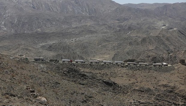 Tanker trucks are stuck on an unpaved road as they take a detour due to fighting between pro-government forces and Houthi rebels, in Yemen's northern province of Marib.