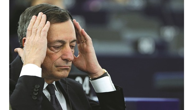 Mario Draghi adjusts his earphones as he attends a debate at the European Parliament in Strasbourg, France on February 1. As the ECB president pumps billions of euros of stimulus into the economy every month, he also faces outside forces including an emerging market-led slowdown and an oil-price slump that threaten to drag eurozone inflation back below zero.