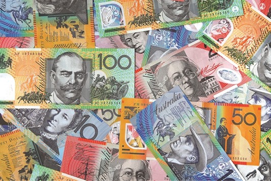 Australian dollar banknotes of various denominations are arranged for a photograph in Sydney. The currency was at 70.96 US cents in Sydney yesterday, having dropped 36% from a record high of $1.1081 reached in 2011.