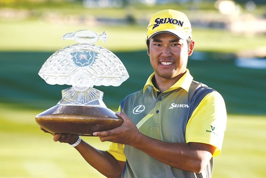 Hideki Matsuyama of Japan poses with the winners trophy on the 18th hole during the final round of the Waste Management Phoenix Open at TPC Scottsdale in Scottsdale, Arizona.(Getty Images/AFP)