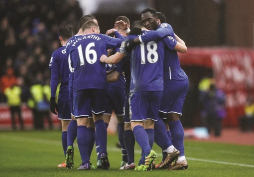 Everton players celebrate their 3-0 win over Stoke City in their Premier League clash on Saturday. (Action Images via Reuters)