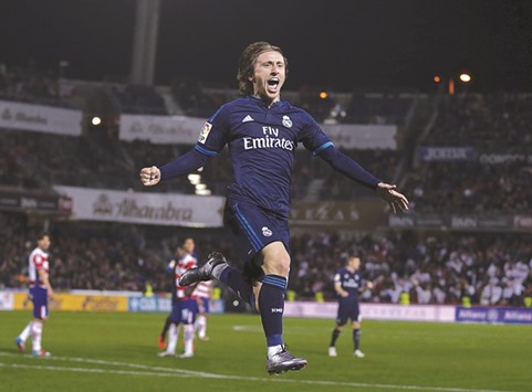 Real Madridu2019s Luka Modric celebrates after scoring the 85th-minute winner against Granada on Sunday. (Reuters)